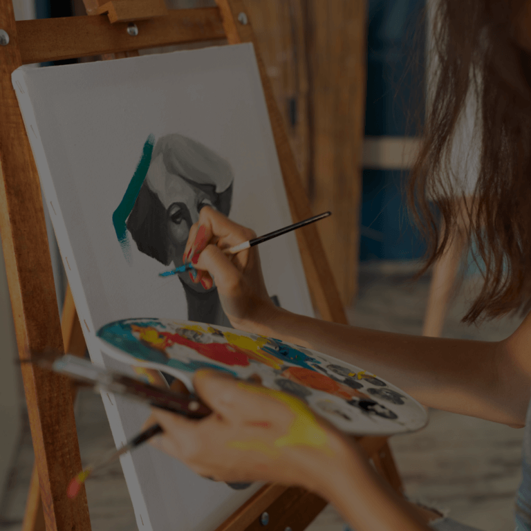 An image of an artist painting on a canvas