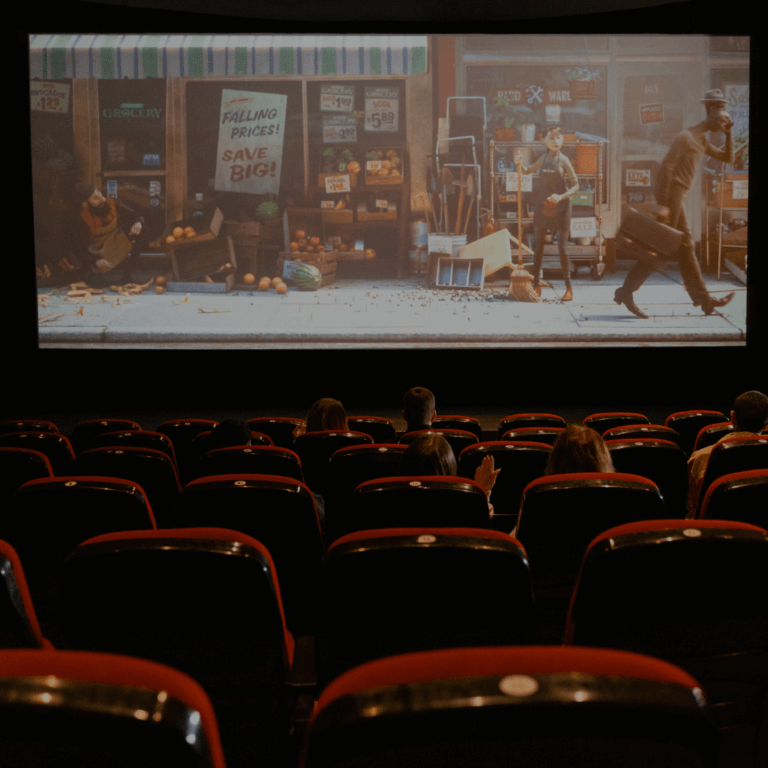An audience watching a movie in a theatre.