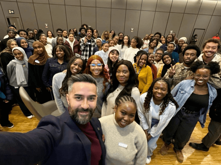 Group of students and staff at an event.