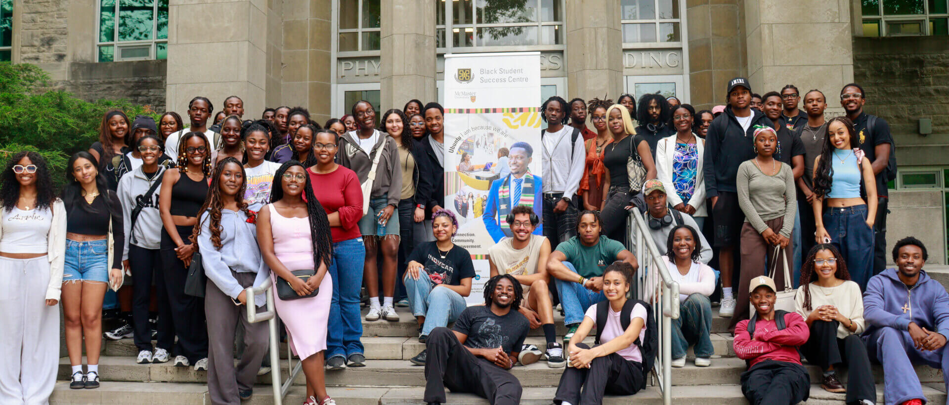 Large group of students around a banner for the Black Student Success Centre.