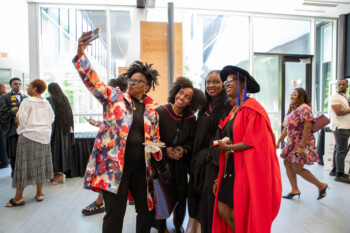 An image of some staff and faculty taking a selfie.